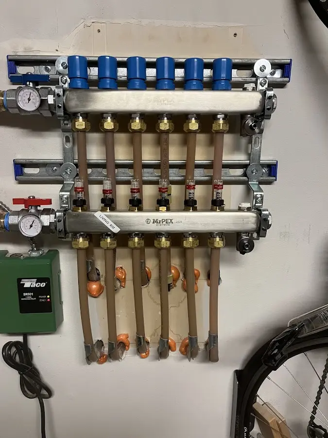 Plumber performing Water Heater Repair at a residential property in Middleville